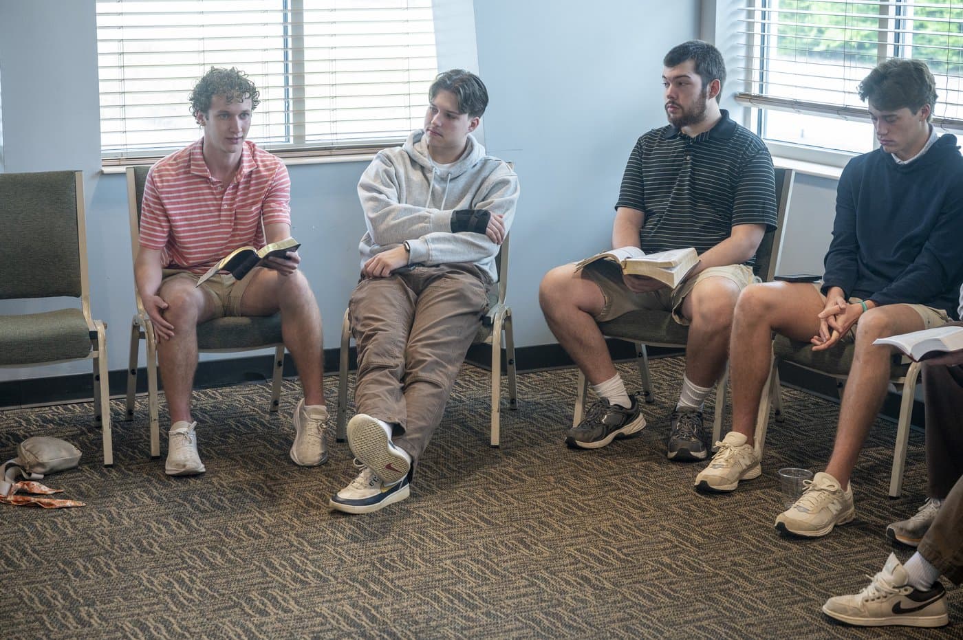Adults in small group Bible study